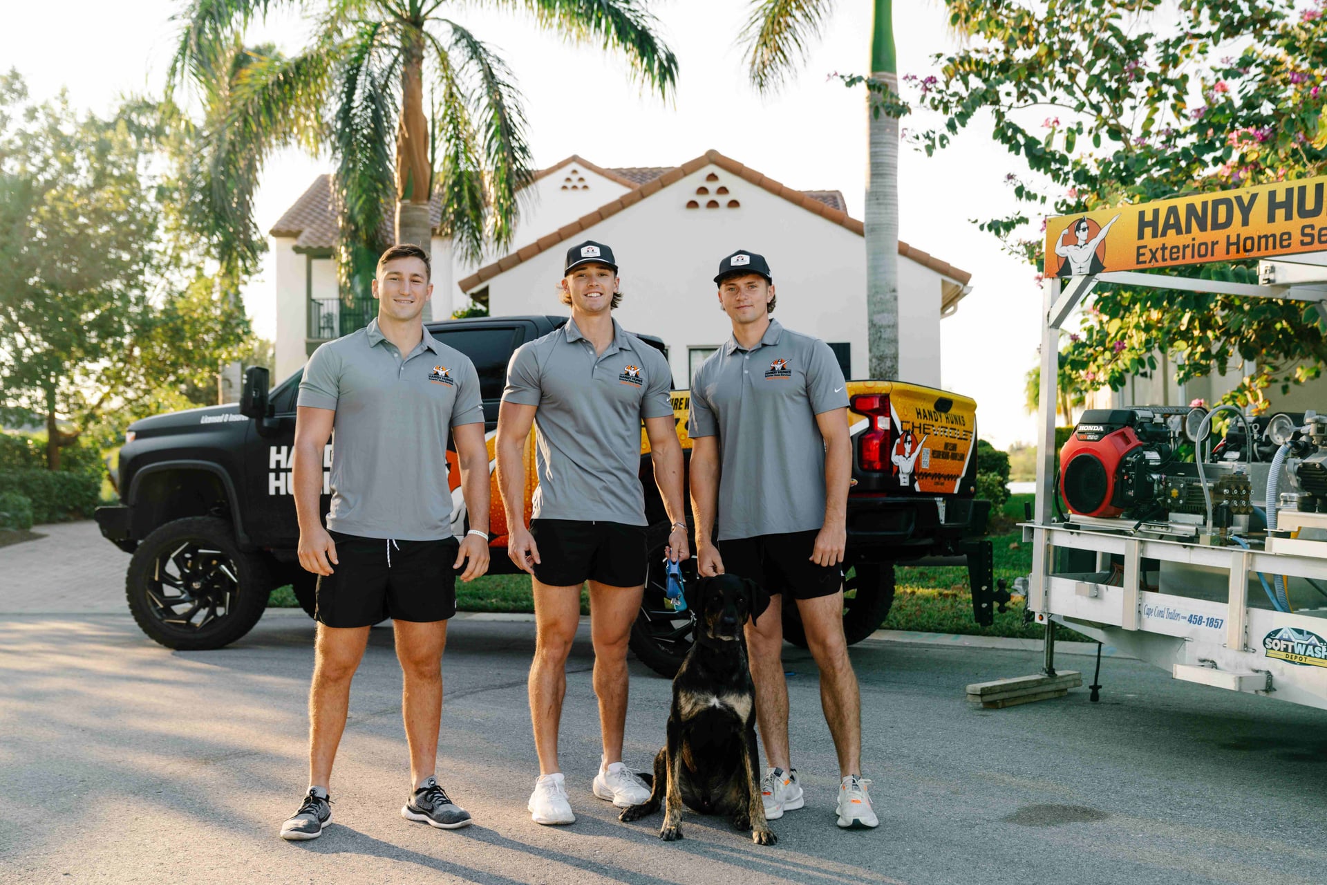 Handy Hunks team with branded truck and equipment